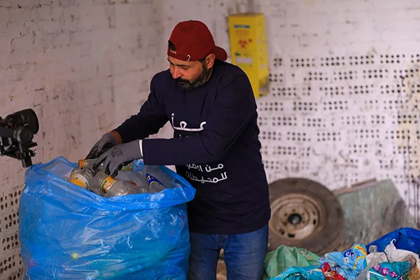 Egyptian Member sorting gathered plastic.