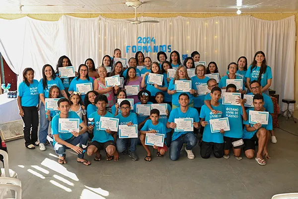 Brazilian members celebrating completion of a computer science course