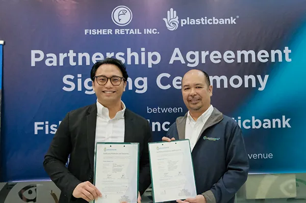 Plasticbank Employee meeting with Fisher Retail for a signing ceremony