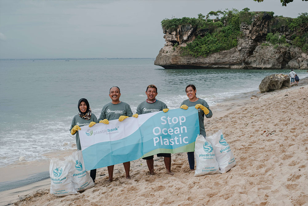 Plastic Bank Members collecting plastic trash in Balangan Beach, Bali, Indonesia