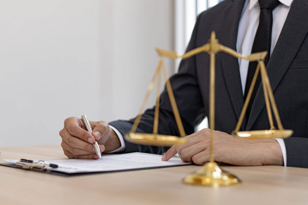 A man in suit writing down something related to law