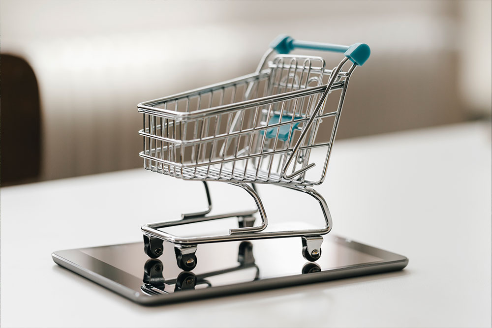 Empty mini shopping cart on the table