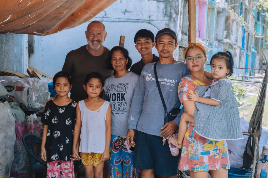 Plastic Bank collectors and David Katz in front of a collection branch in the Philippines 
