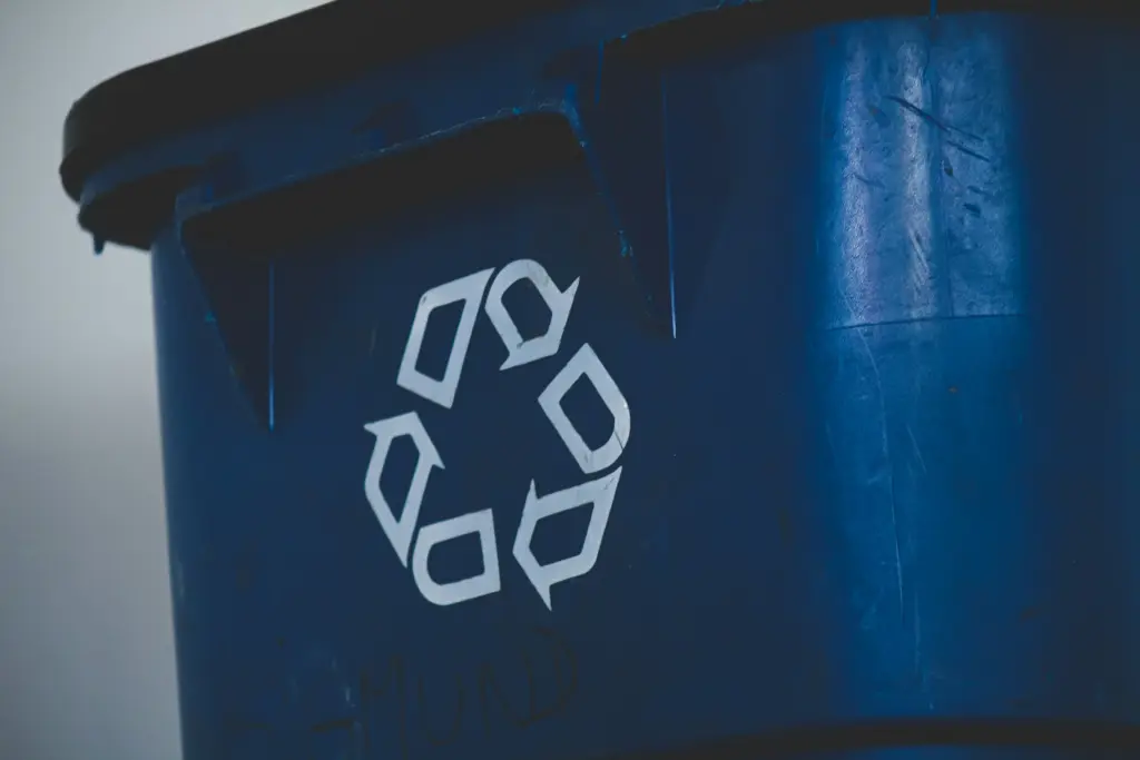 Reduce, reuse, recycle symbol on a waste bin
