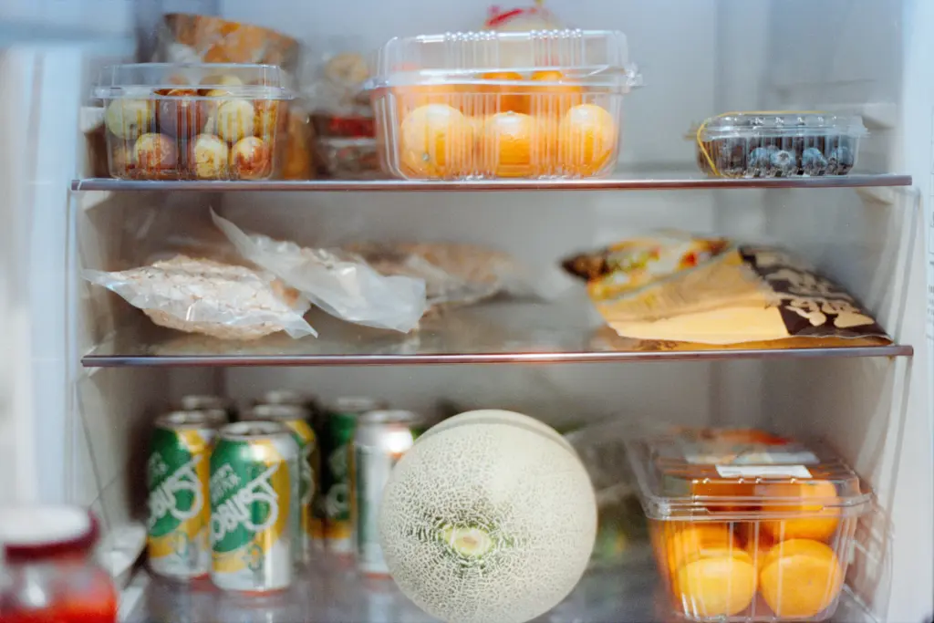 An open refrigerator with various food inside