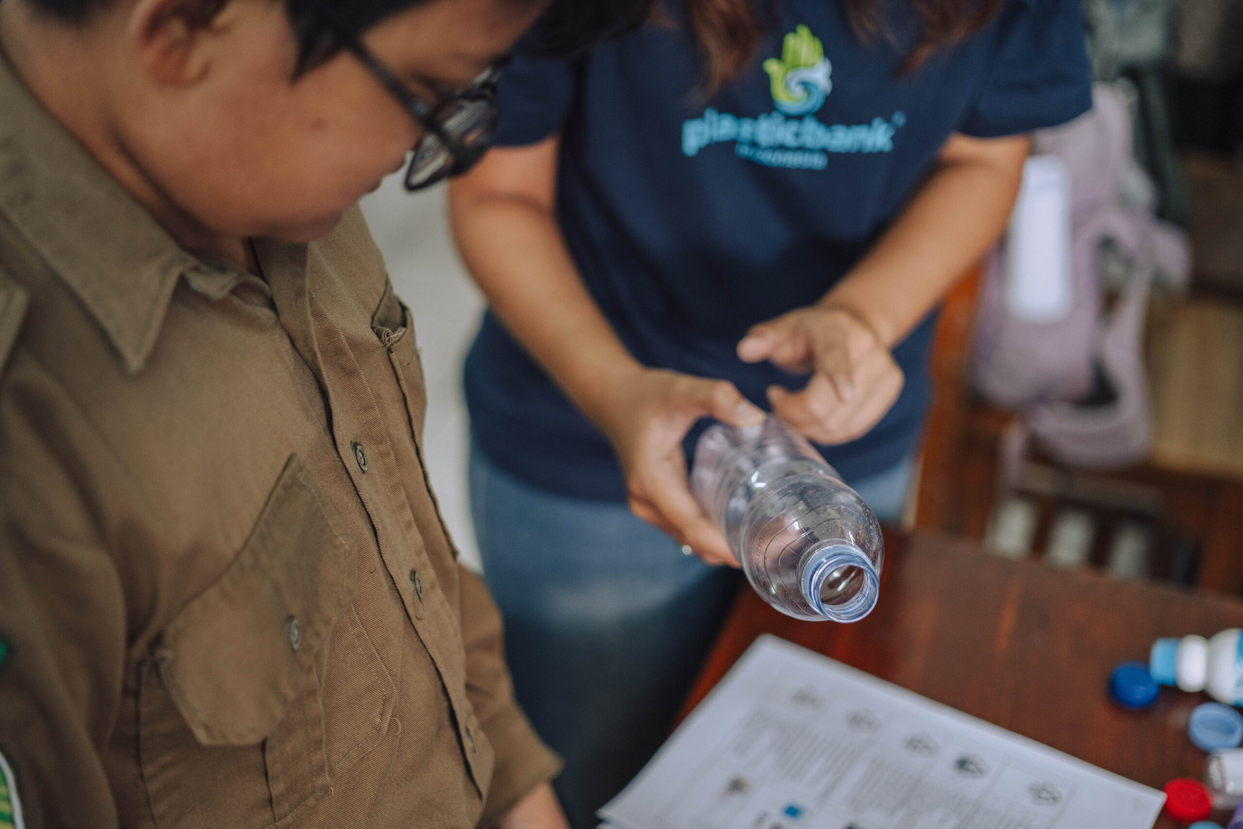 A student learning to segregate plastic waste