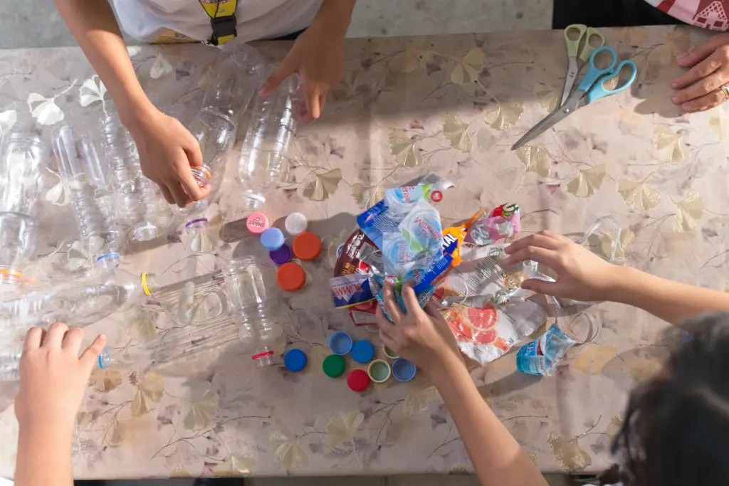 Bottle caps and labels separated from plastic bottles for household segregation